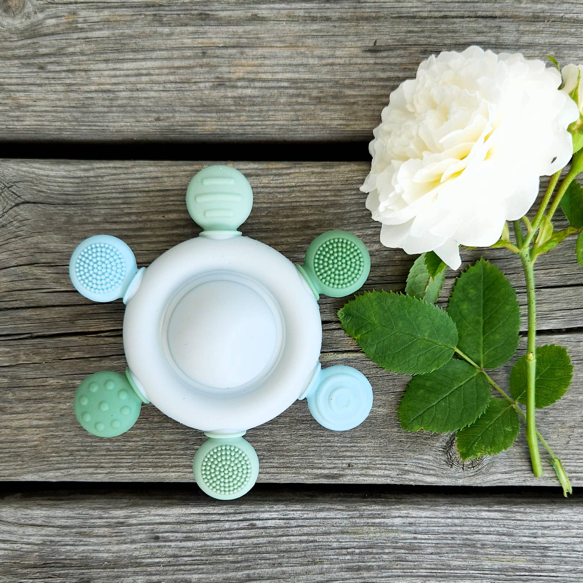 Baby Silikon Rassel & Beißspielzeug Karussell Grün